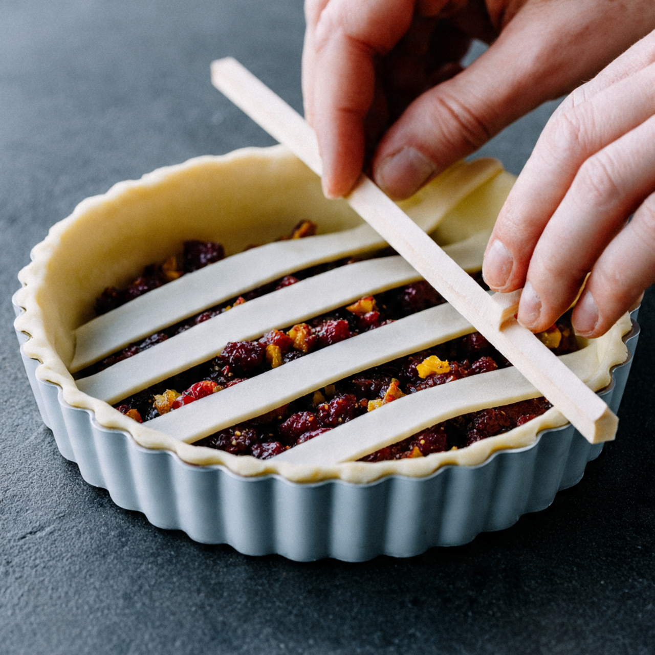 Unbaked crostata in tart pan, par-baked crust filled with homemade fig compote made from Black Mission figs